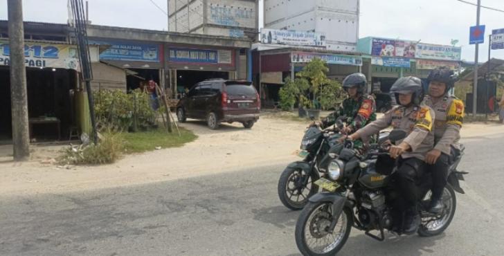 Personel Bhabinkamtibmas Bunut Pastikan Keamanan Masyarakat Menjelang Pemilu